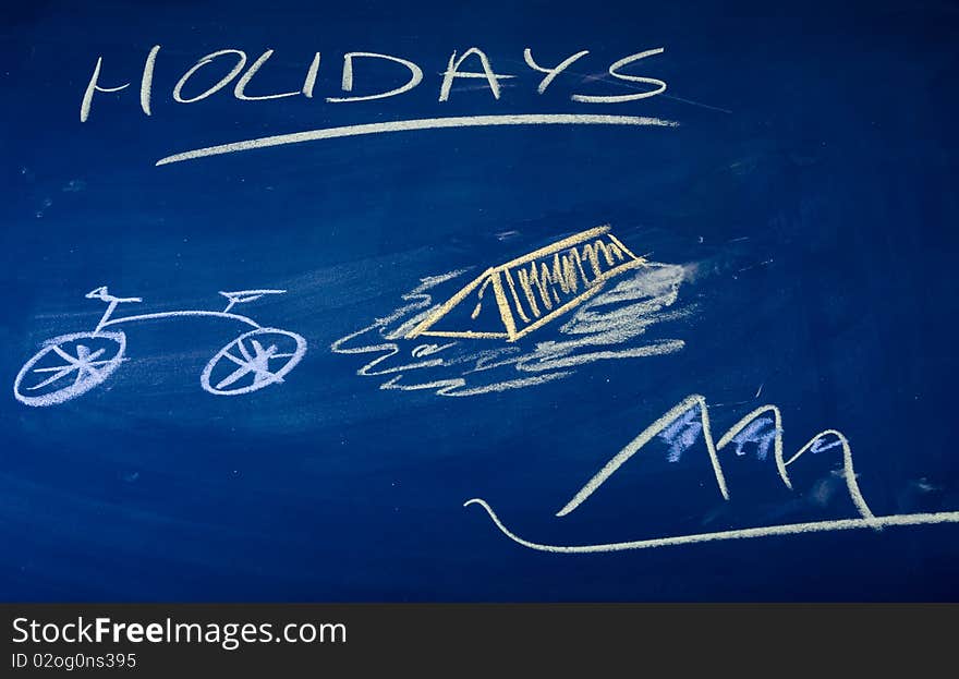 Holidays described on green chalkboard