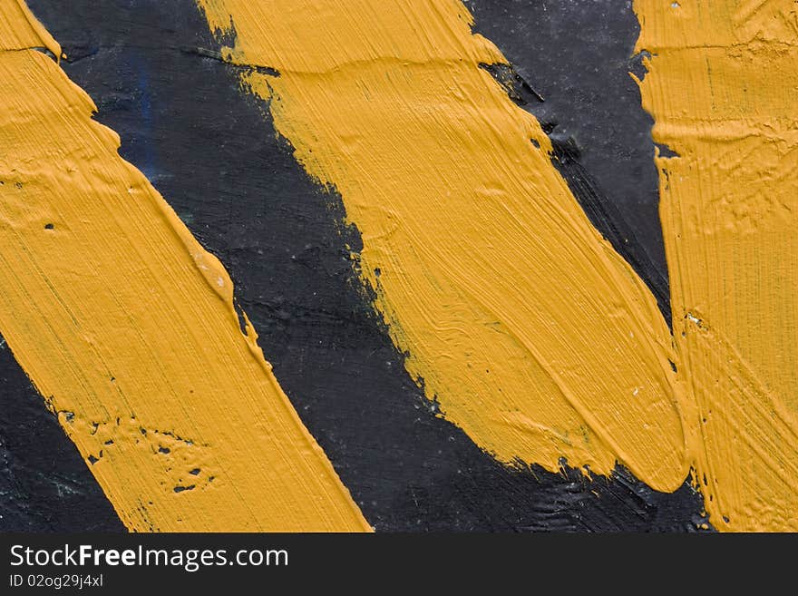 A background of black roughly painted abstract picture with thick yellow lines. A background of black roughly painted abstract picture with thick yellow lines