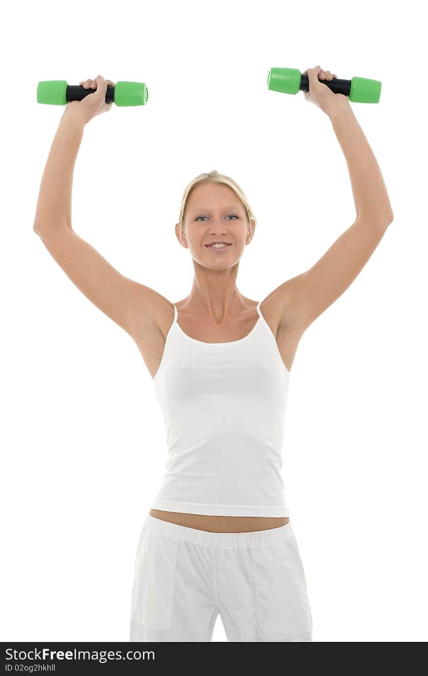 Portrait of a young caucasian woman who trains with dumbbells in hand