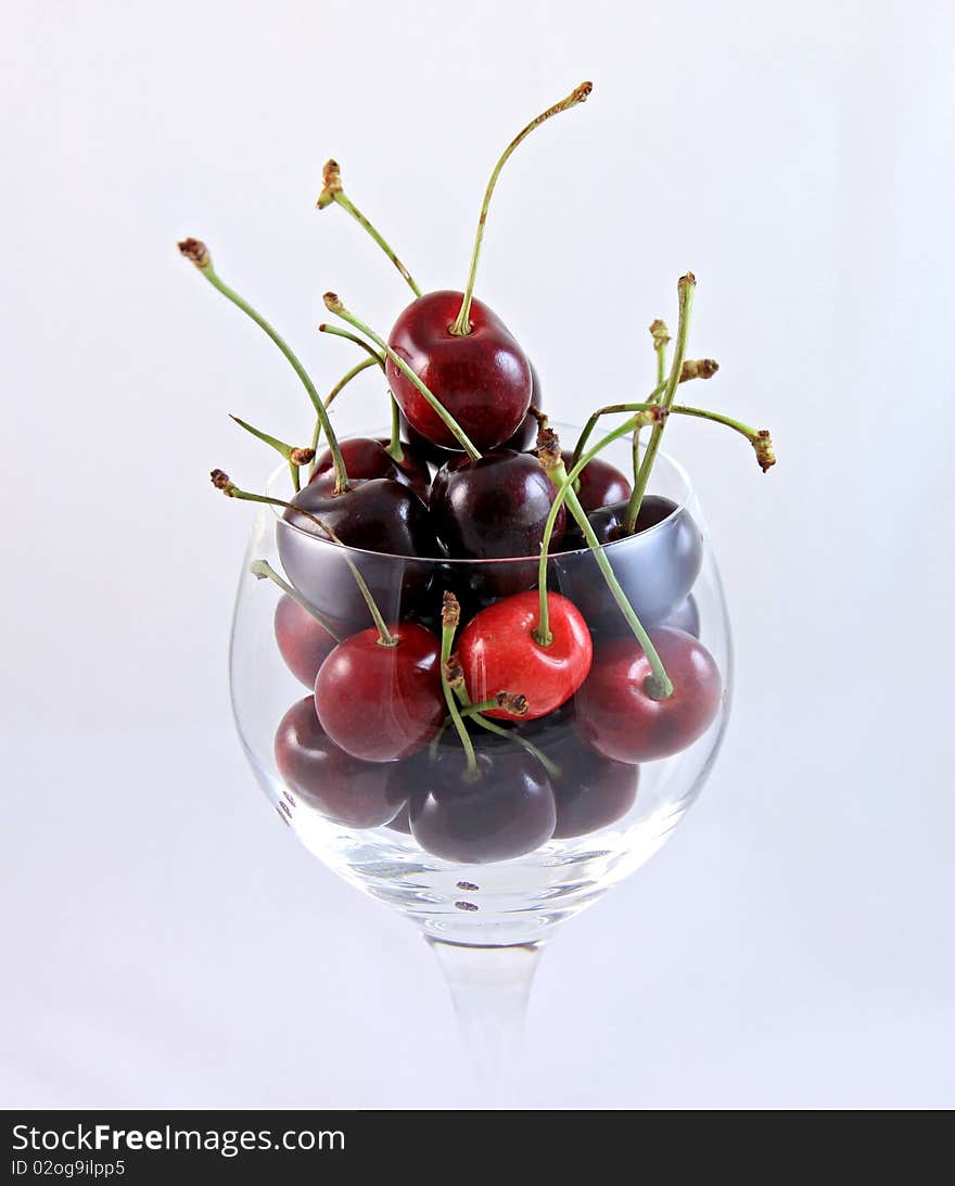 Fresh Ripe Cherries in a wine glass