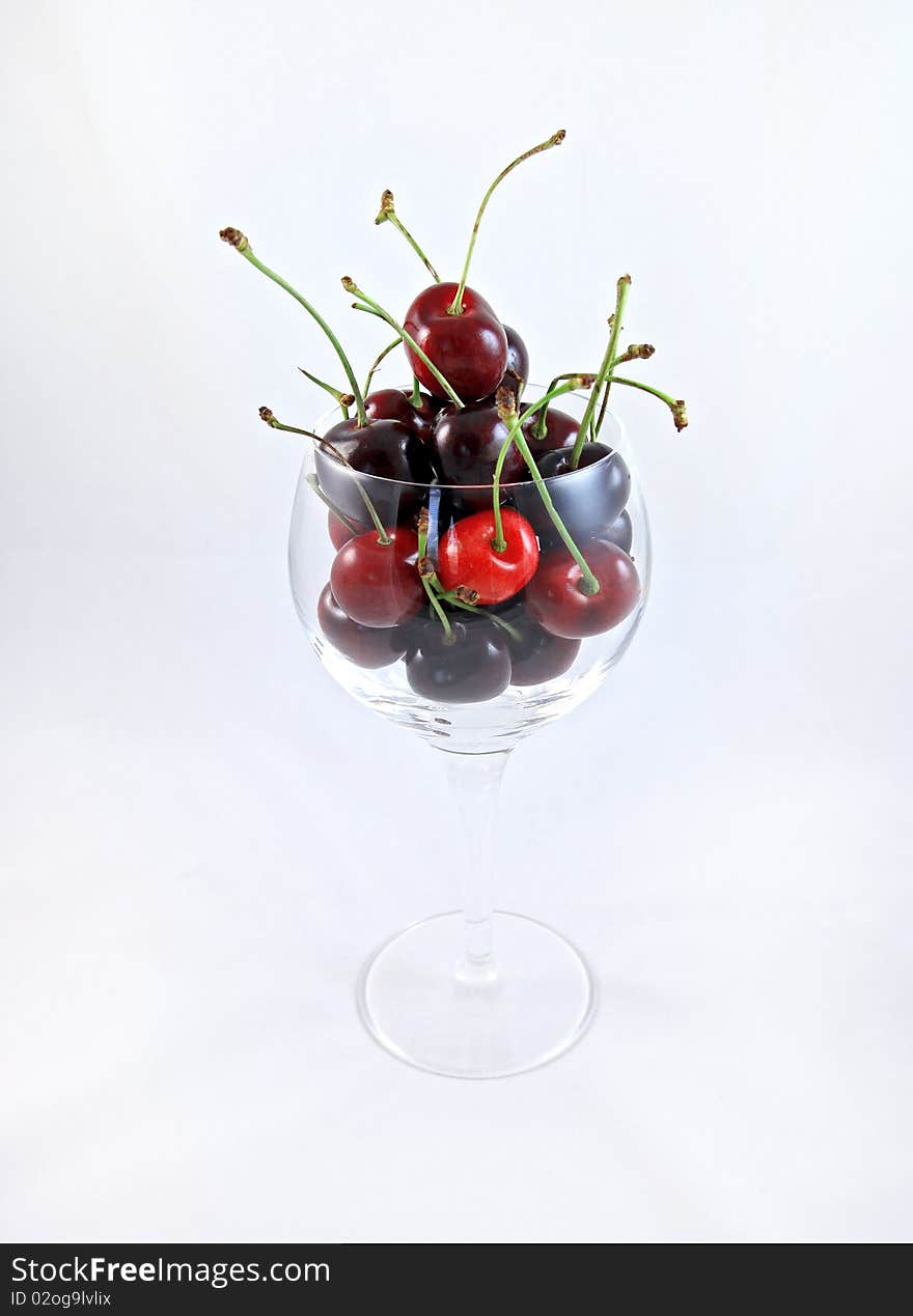 Fresh Ripe Cherries in a wine glass