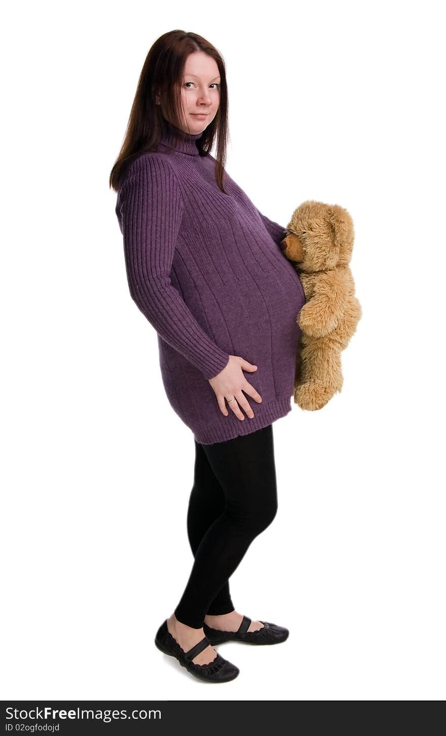 Beautiful pregnant girl in a purple sweater, isolated on white. Beautiful pregnant girl in a purple sweater, isolated on white