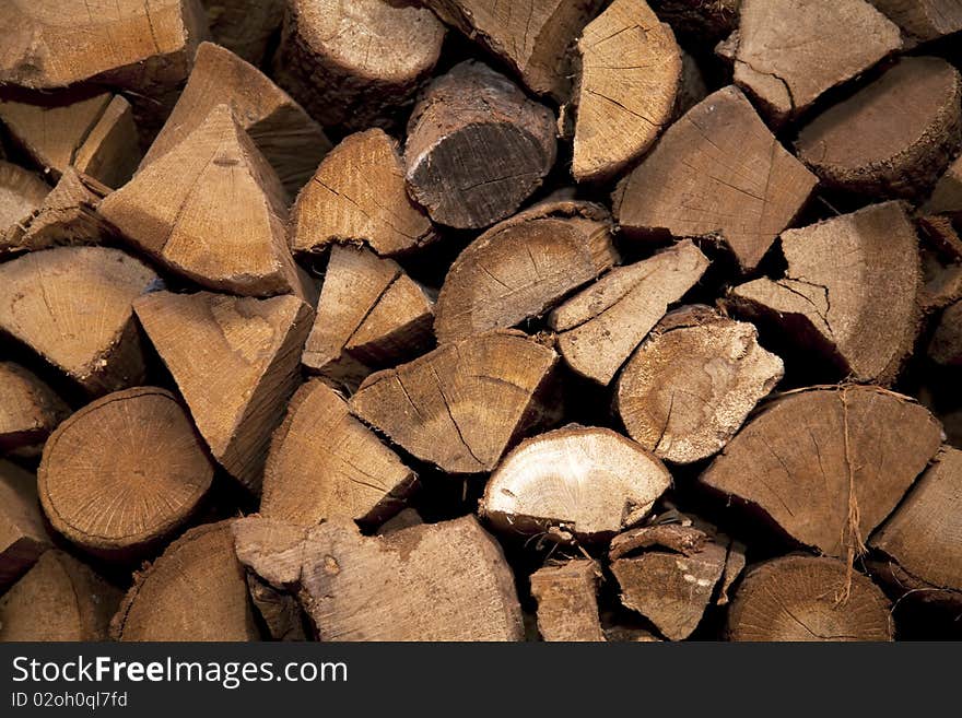 A pile of wooden logs. Lots of texture and ring detail in the wood. A pile of wooden logs. Lots of texture and ring detail in the wood.