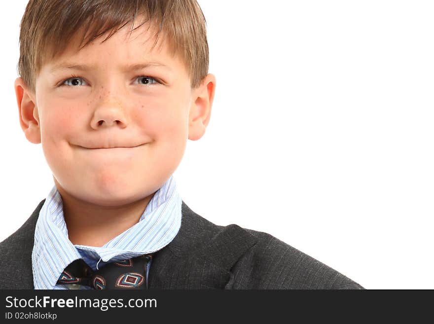 Adorable seven year old american boy in over sized large suit over white. Adorable seven year old american boy in over sized large suit over white.