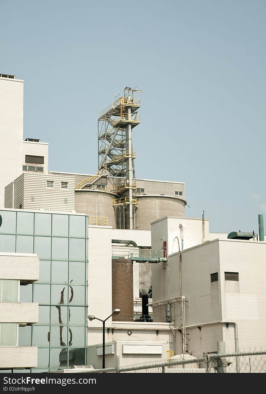 Brick buildings and polluting smoke from factory