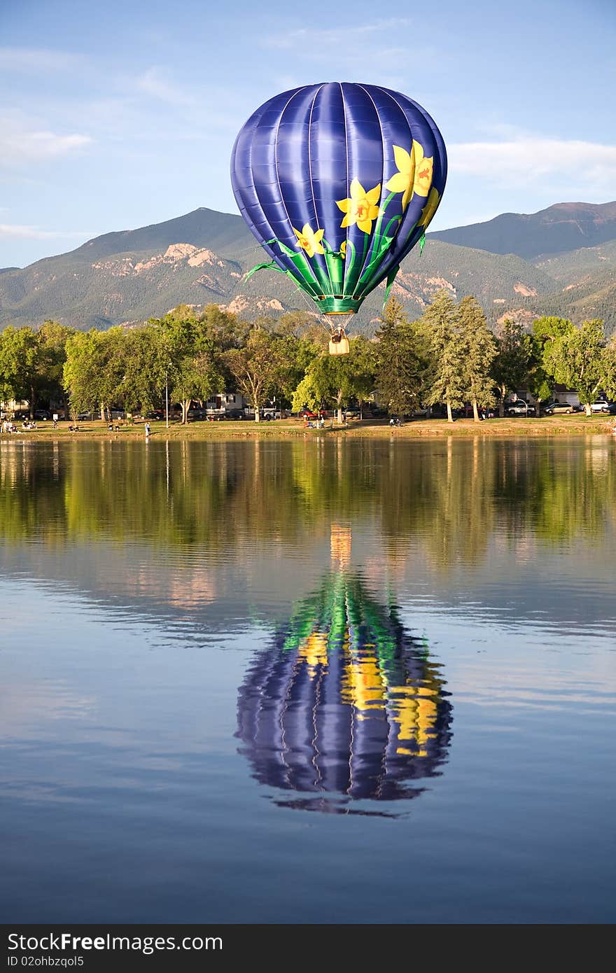 Colorful balloon above Colorado Springs' Prospect Lake during the Colorado Balloon Clsssic. Colorful balloon above Colorado Springs' Prospect Lake during the Colorado Balloon Clsssic