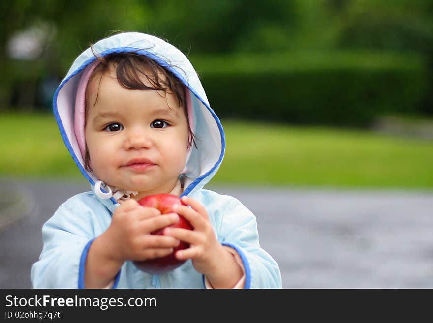 Portrait of the beautiful child holding an apple. Portrait of the beautiful child holding an apple