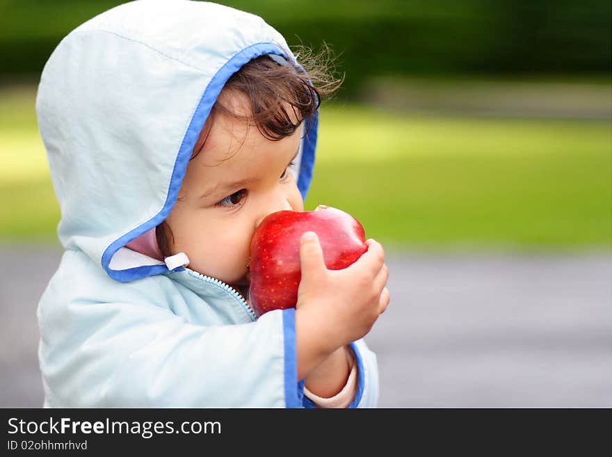 Portrait of the beautiful child holding an apple. Portrait of the beautiful child holding an apple