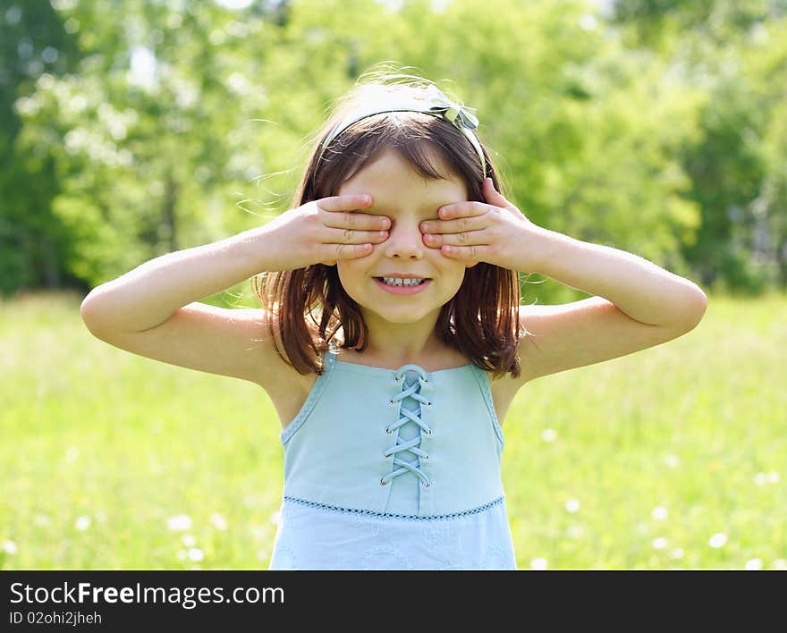 Young beautiful girl plays outdoors. Young beautiful girl plays outdoors