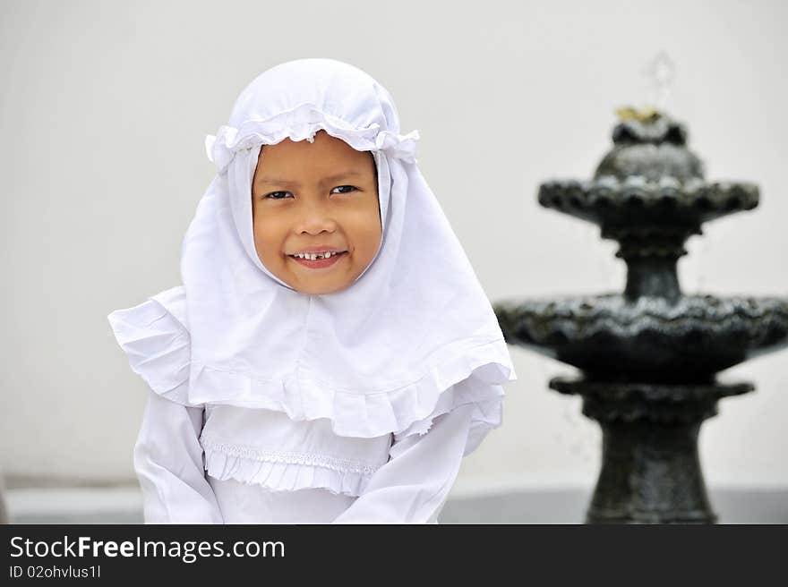 Outdoor portrait of happy Muslim girl. Indonesia. Outdoor portrait of happy Muslim girl. Indonesia