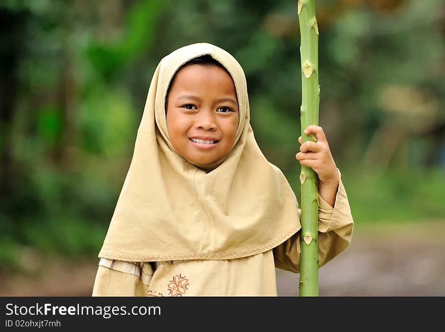 Outdoor portrait of happy Muslim girl. Indonesia. Outdoor portrait of happy Muslim girl. Indonesia