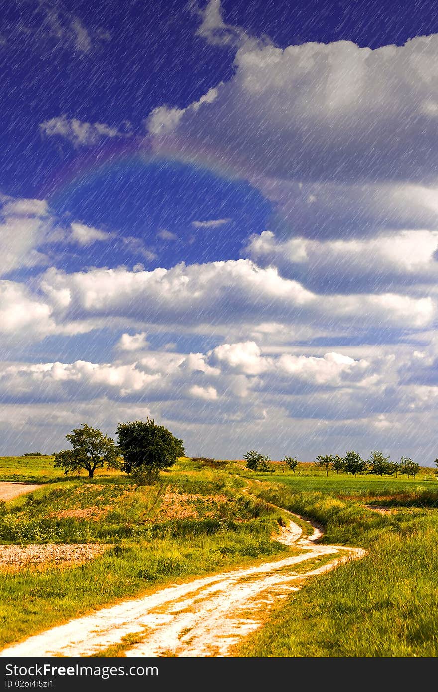 Light rain over land on a sunny day