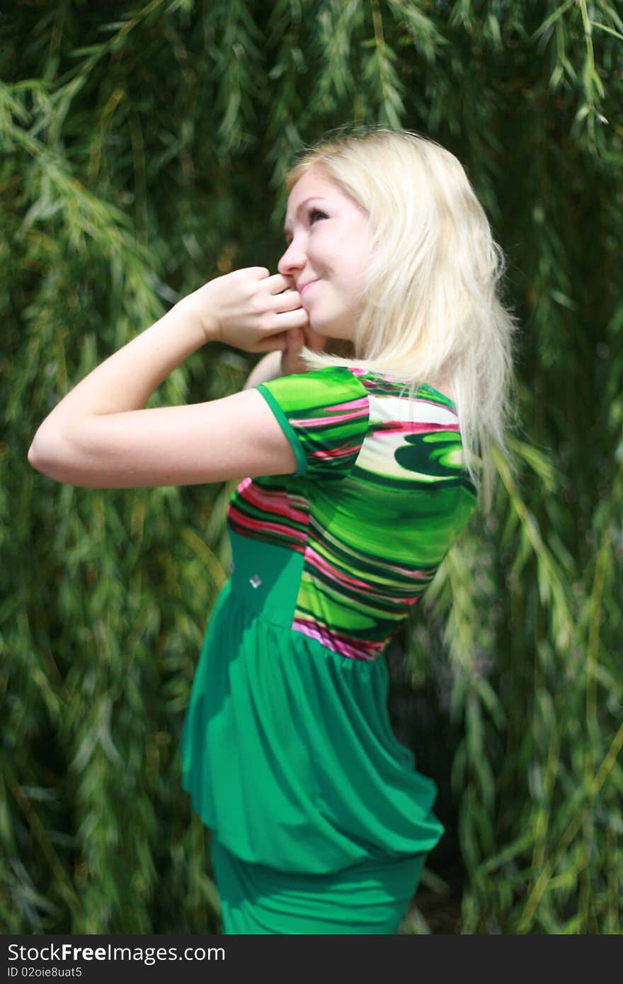 Pensive young woman enjoying sunny day