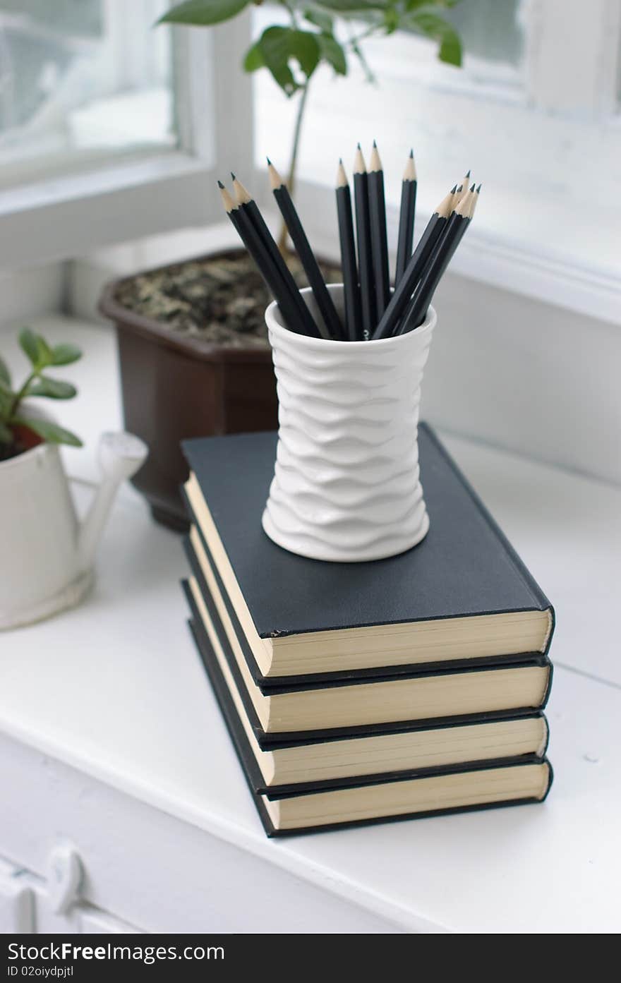 Books, flowers and pencils