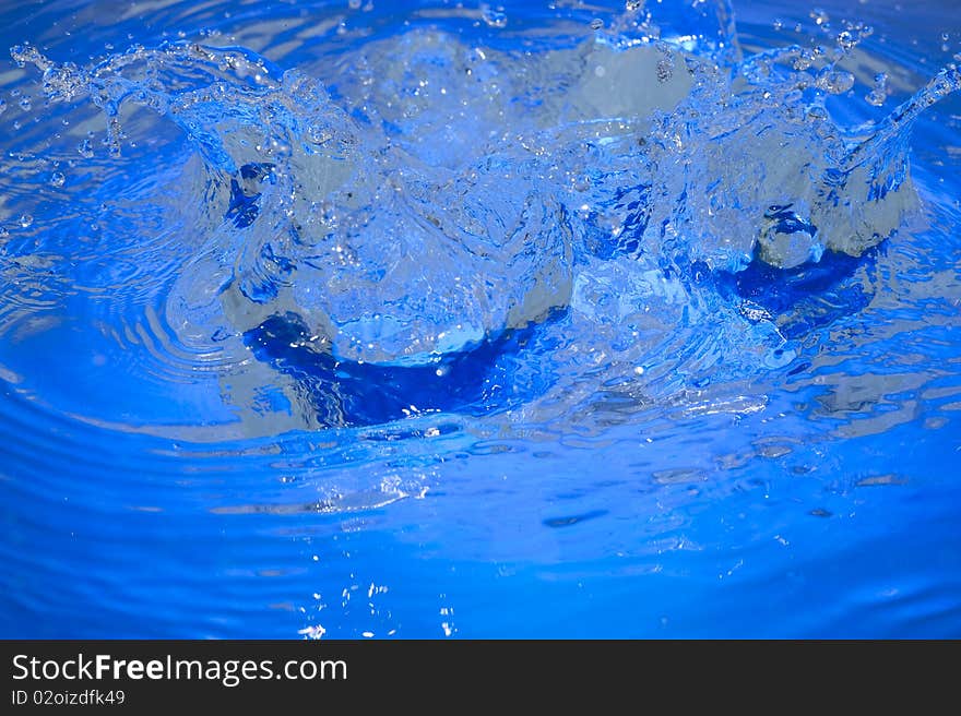 Blue background with raindrop. Ripple water. Blue background with raindrop. Ripple water