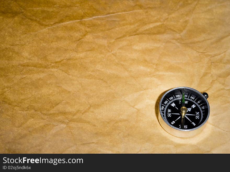 Texture old paper and compass . Brown background