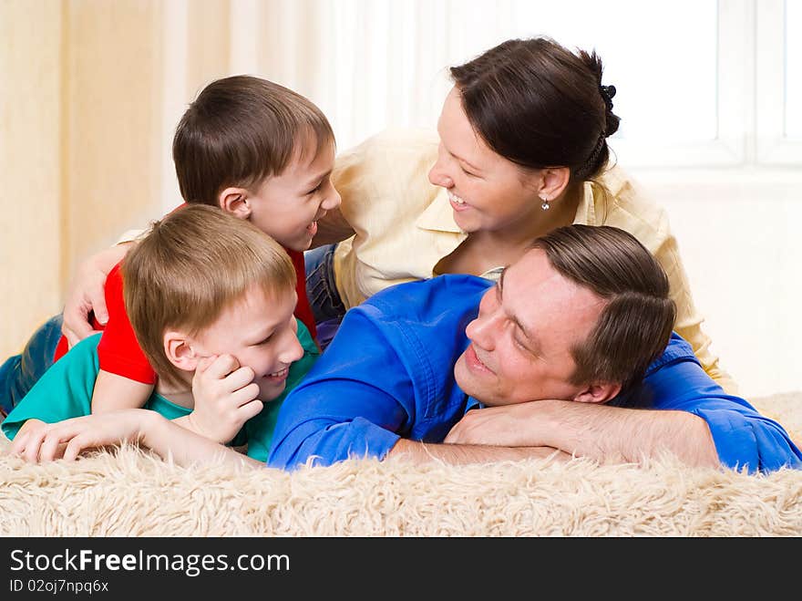 Happy family four on a light