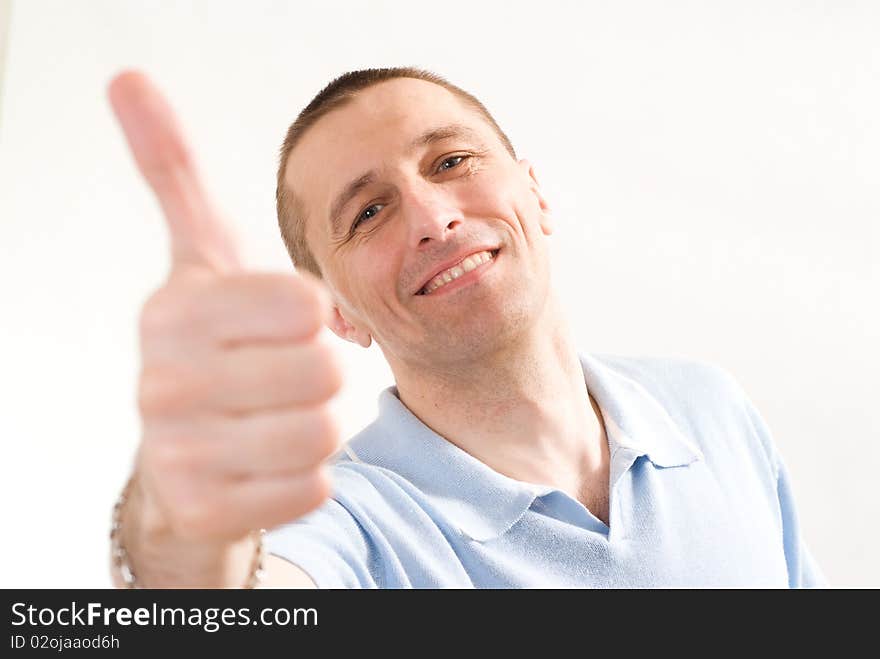 Happy man in a blue shirt