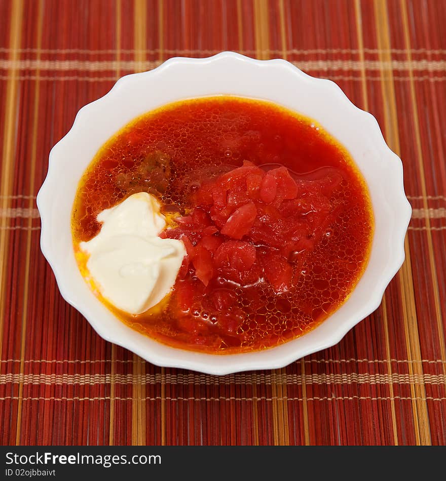 Bowl of soup with beets and cream