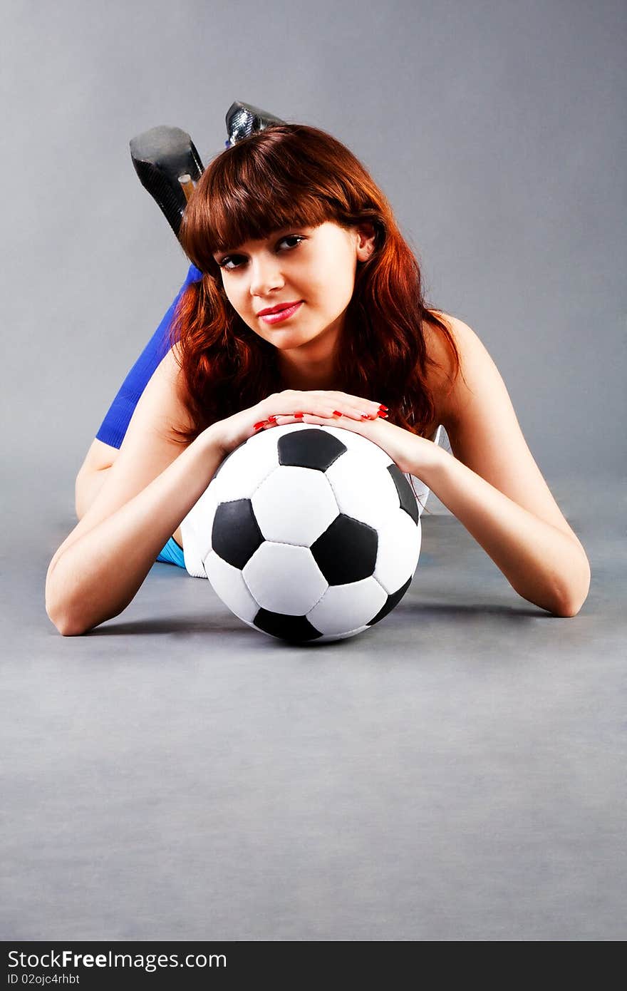 Young girl with a soccer ball