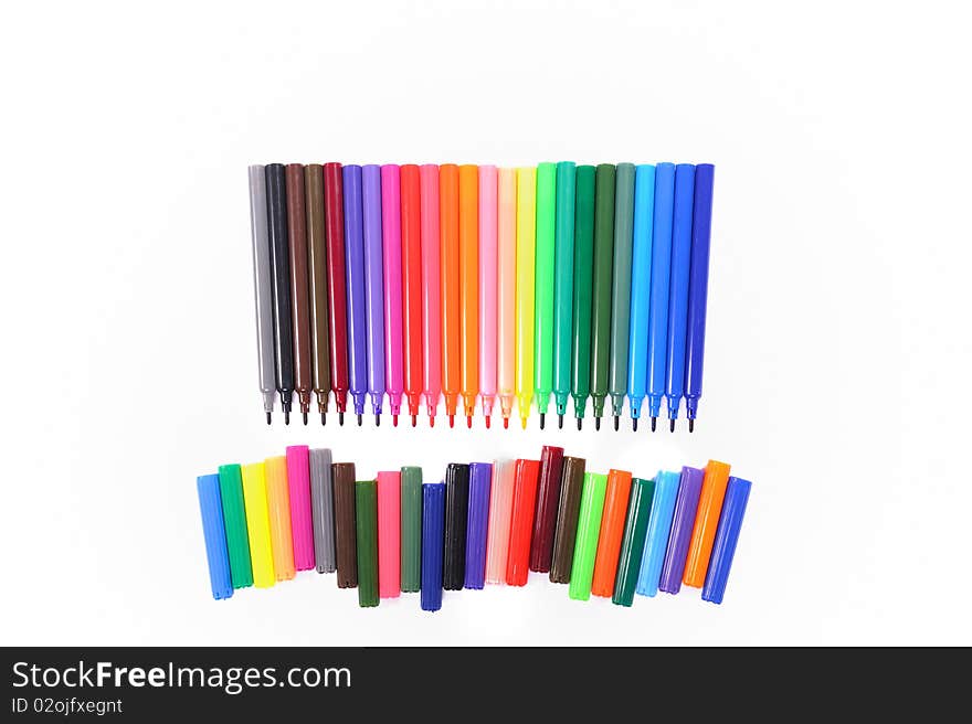 Arranged colorful tip-pen markers isolated on white background