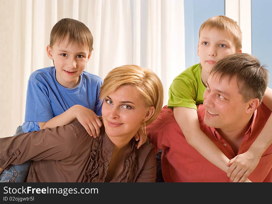 Family four on a light background. Family four on a light background