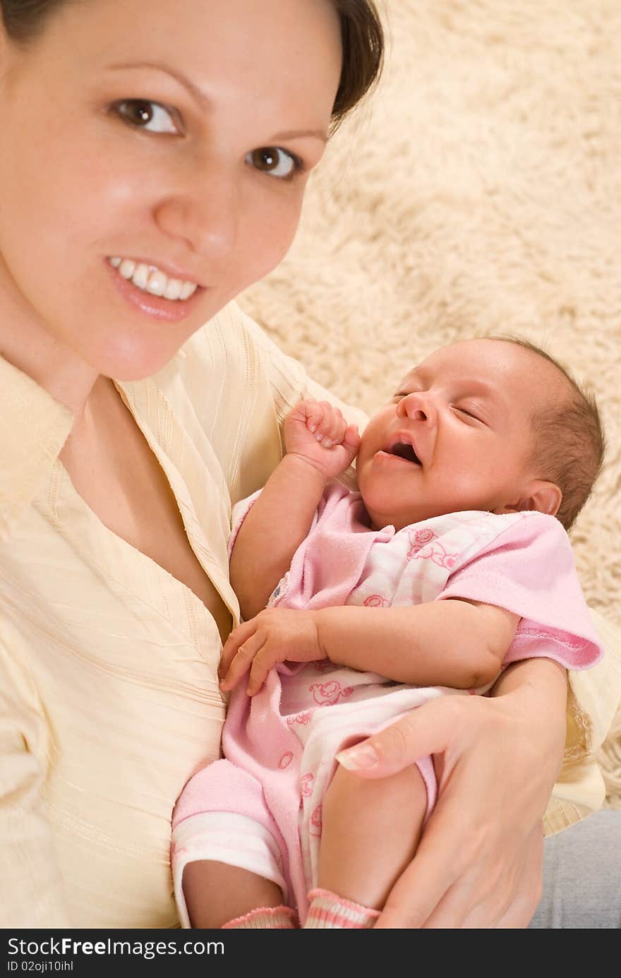 Mother holds the baby