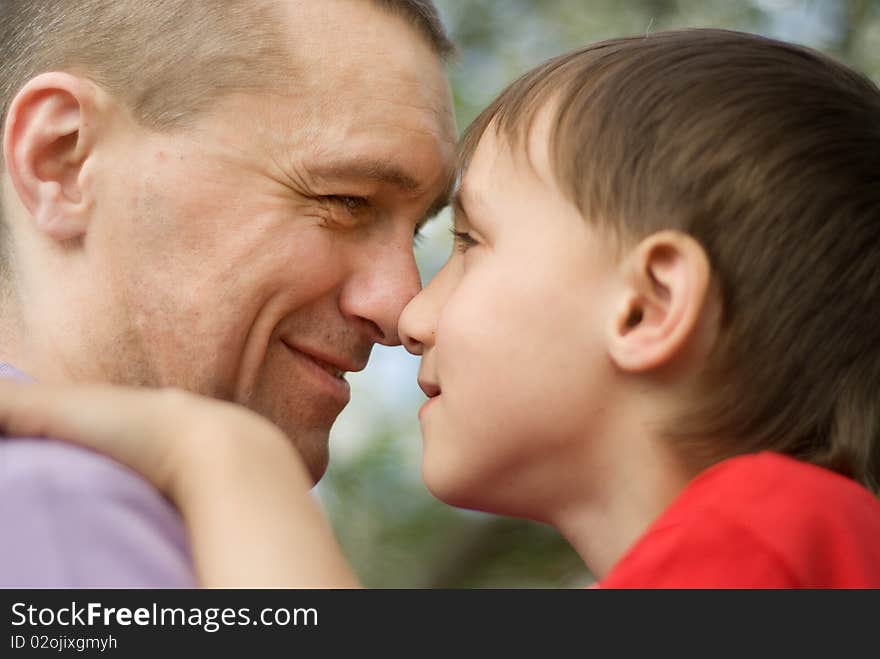 Happy father with his son in a park