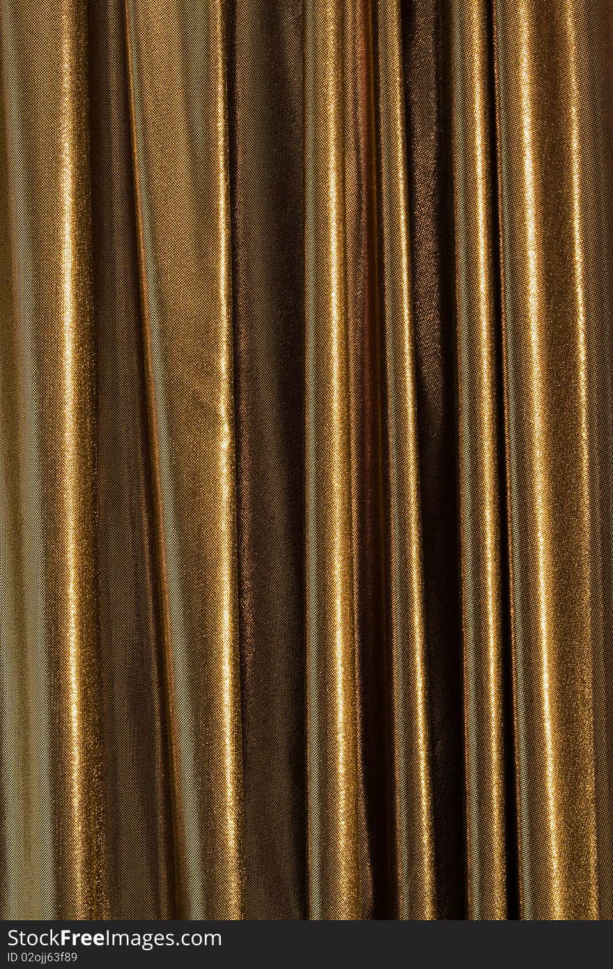 A golden curtain with reflecting light