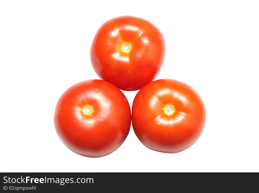 Three red tomatoes isolated on white