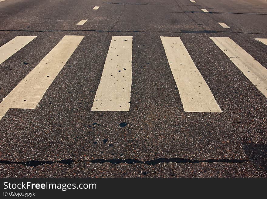 Pedestrian crossing on road at day