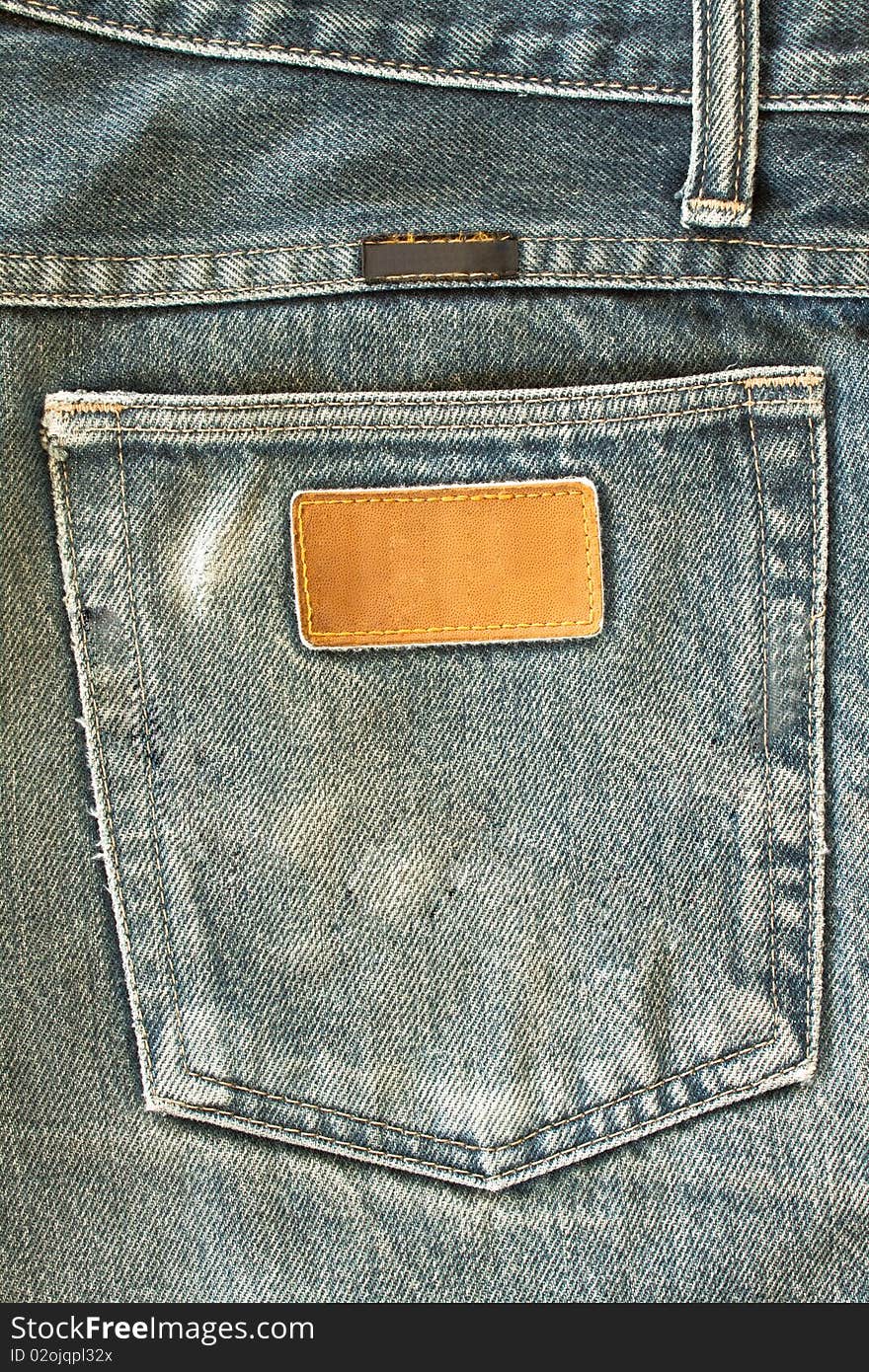 Fragment of modern jeans with pocket, can be used as a background. Fragment of modern jeans with pocket, can be used as a background