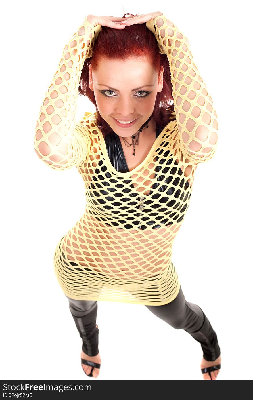 Young beautiful fashion model with red hair and a fishnet shirt. Young beautiful fashion model with red hair and a fishnet shirt.