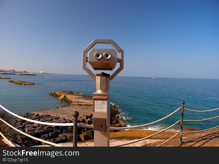 Large coin operated binocular looking at the Atlantic Ocean. Coast of Tenerife Island, Canaries, Spain.