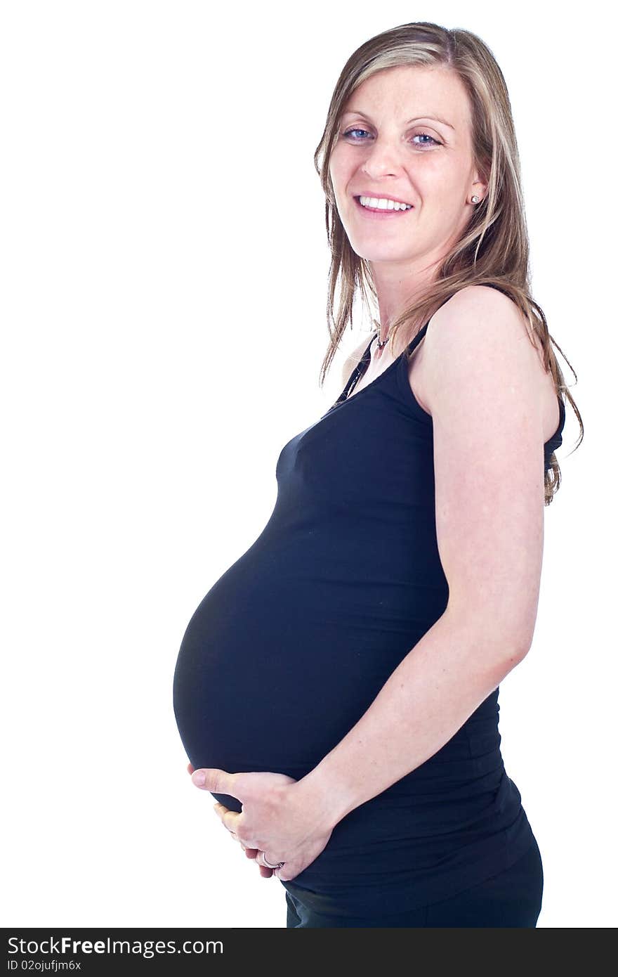 Young beautiful pregnant woman isolated over white background. Young beautiful pregnant woman isolated over white background.