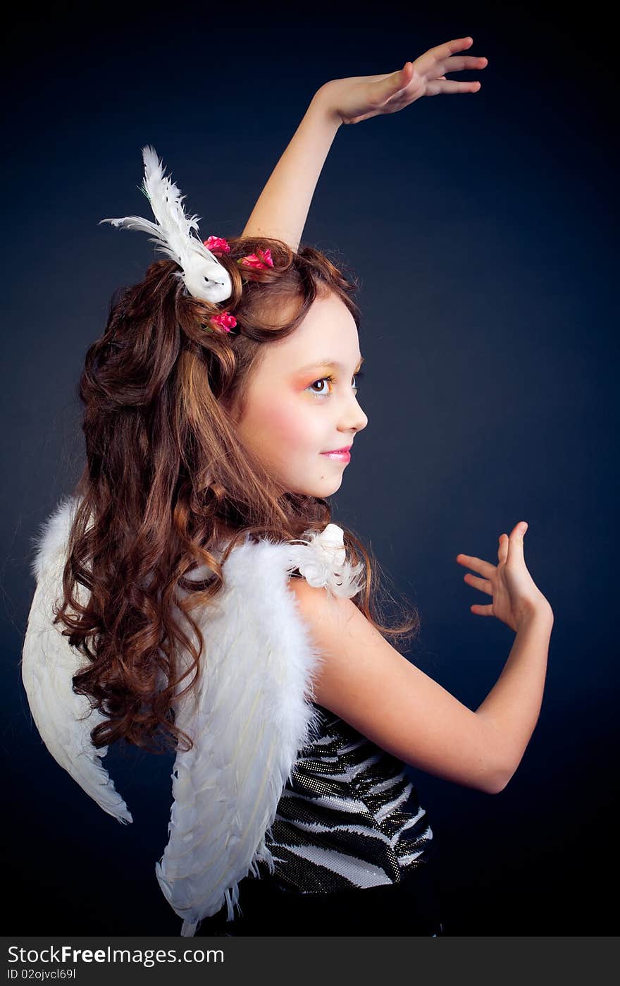 Young girl posing on black background