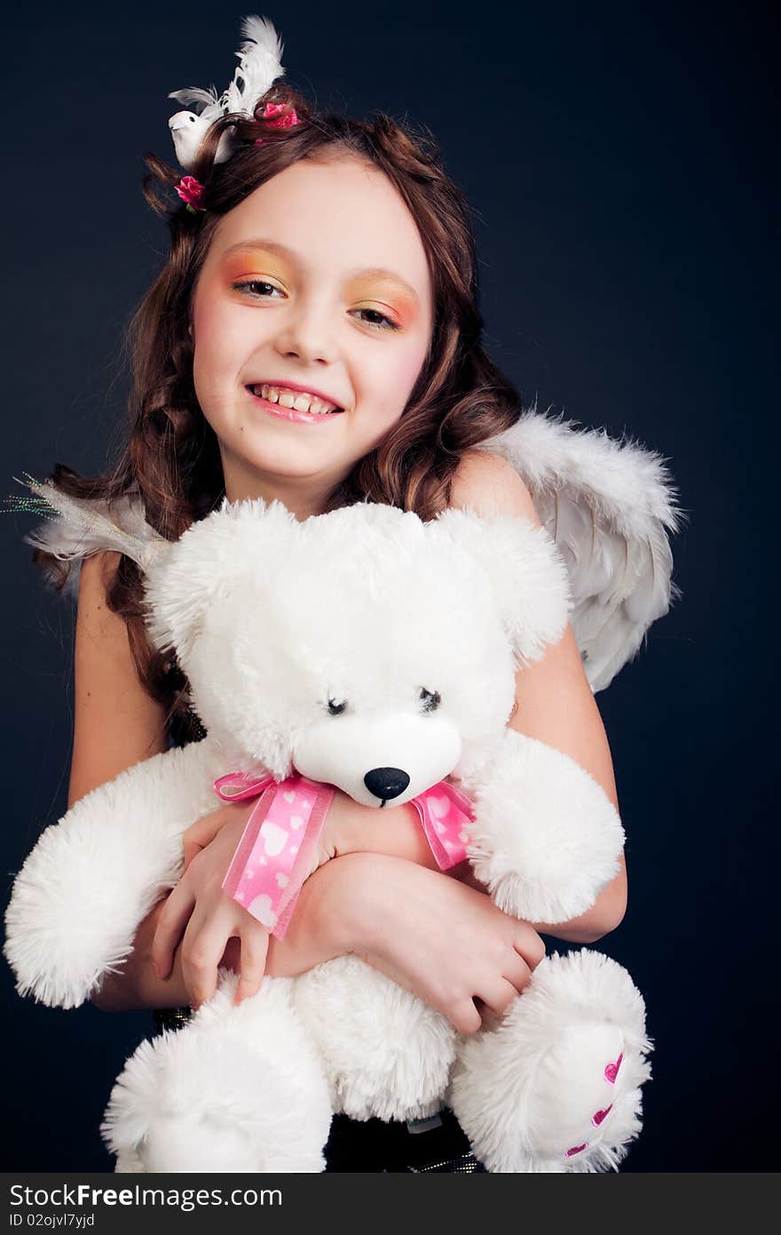 Young girl posing on black background