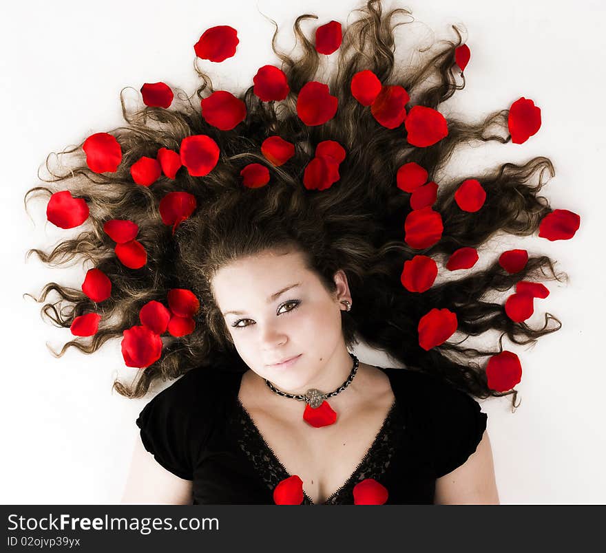 Girl with blooms in her spread hair. Girl with blooms in her spread hair