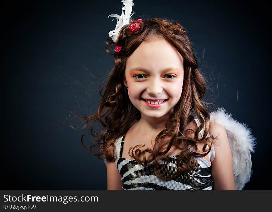 Young girl posing on black background