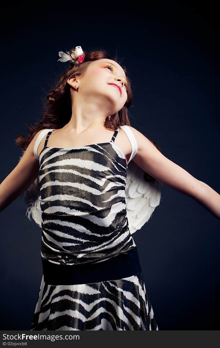 Young girl posing on black background