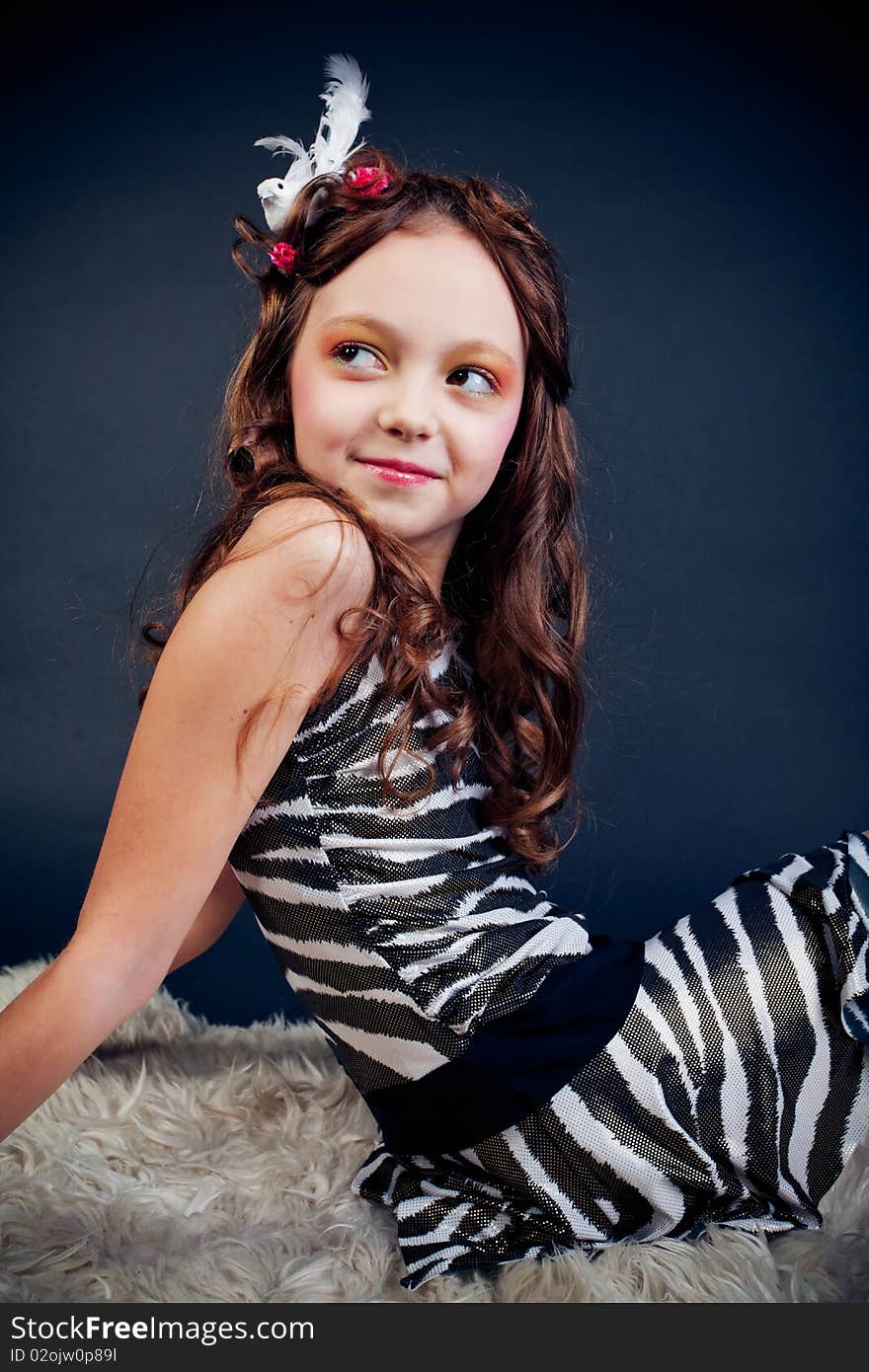 Young girl posing on black background