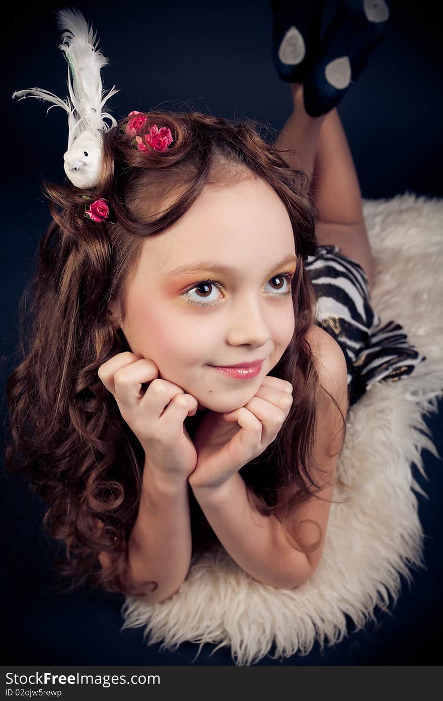 Young girl posing on black background