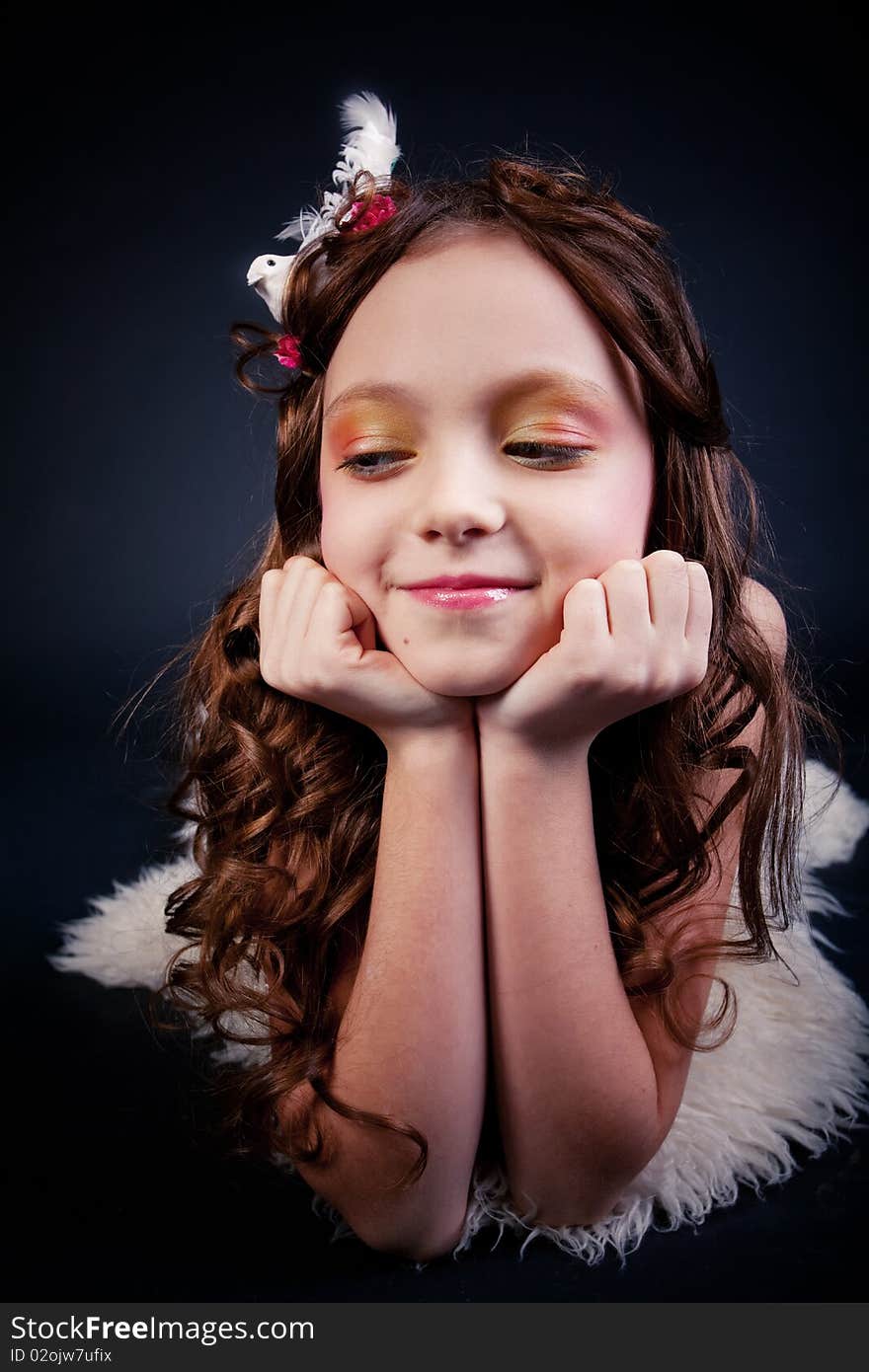 Young girl posing on black background