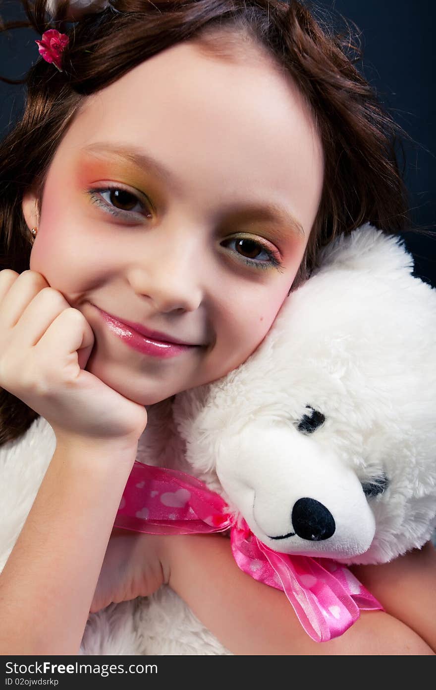 Portrait of young girl with toy