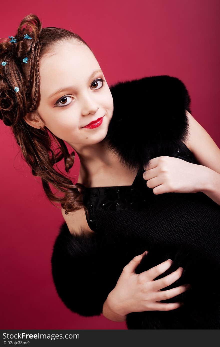 Young Girl Posing On Red Background