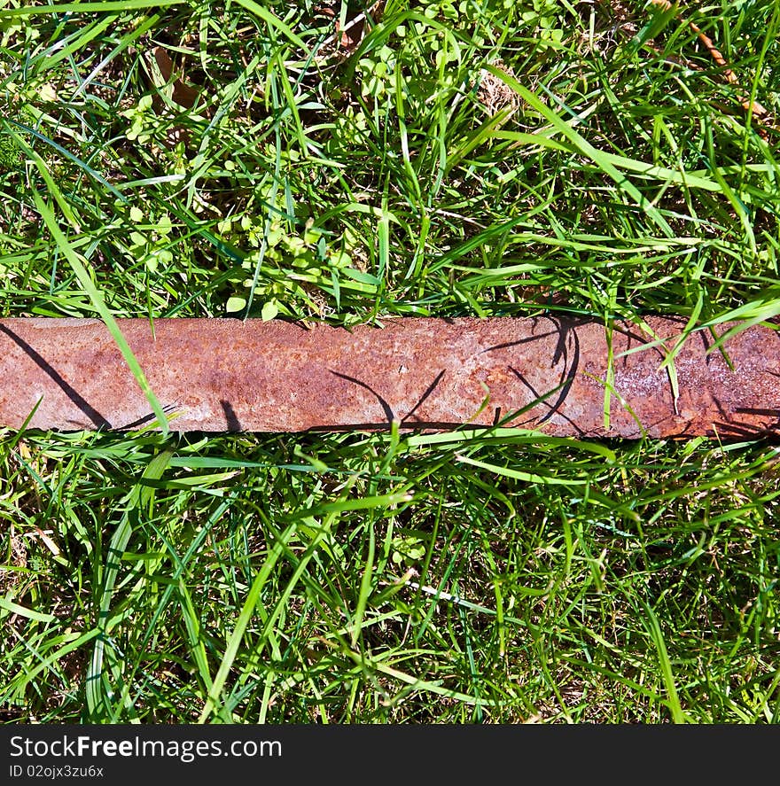 Rotten pipe in the grass