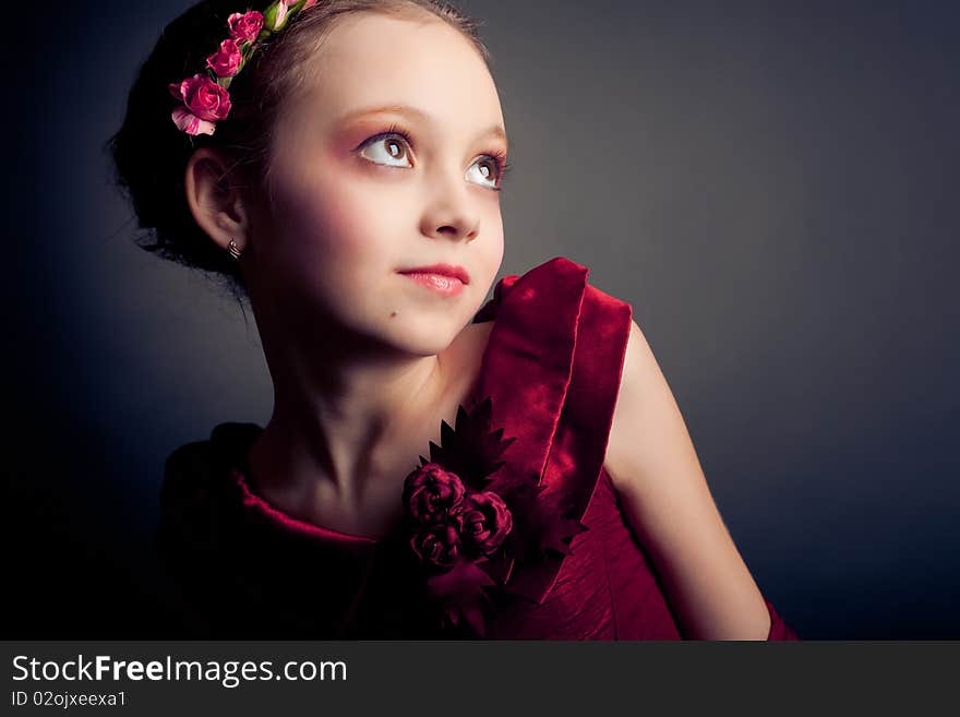 Young girl posing on black background