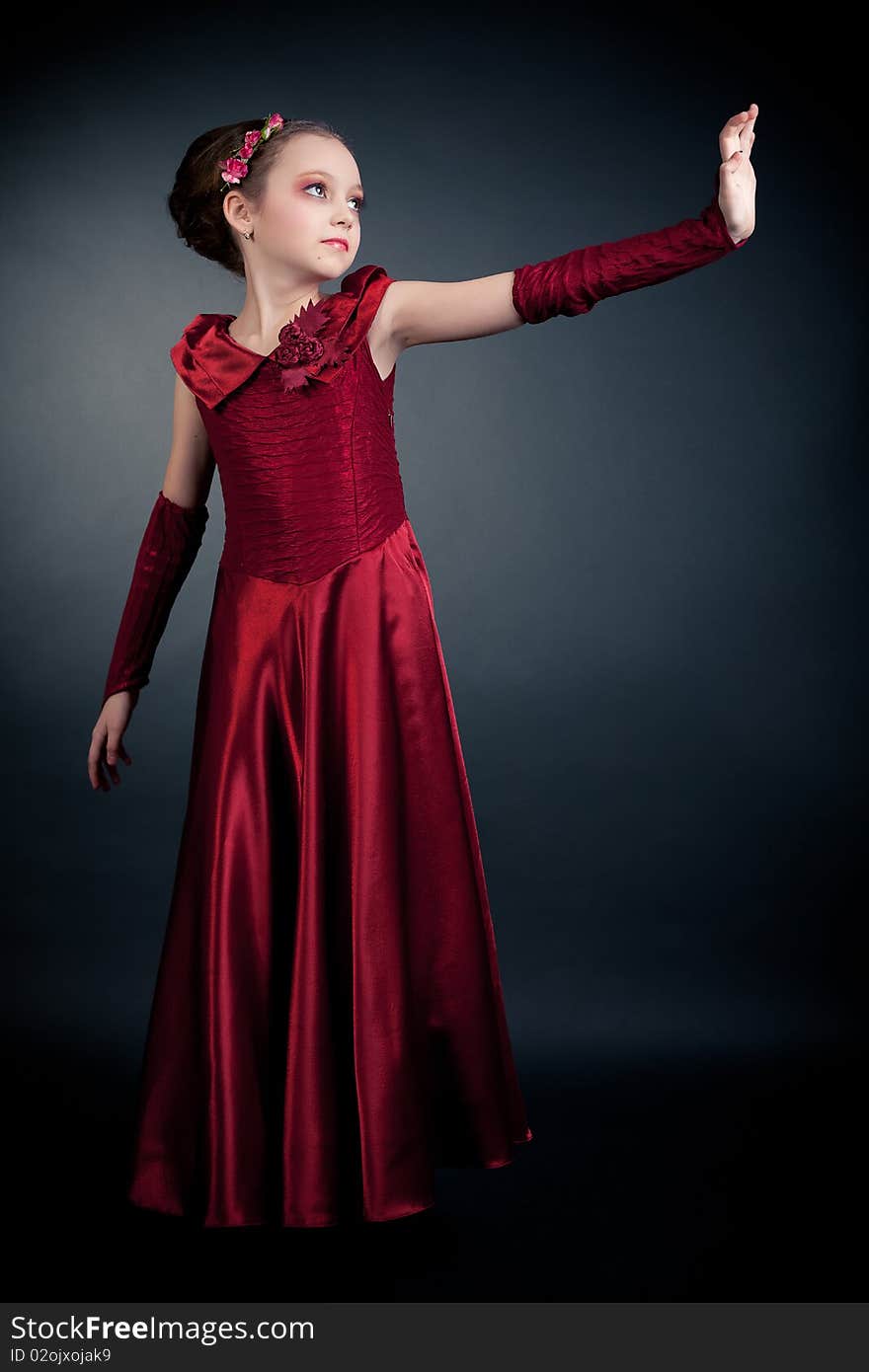 Young girl posing on black background