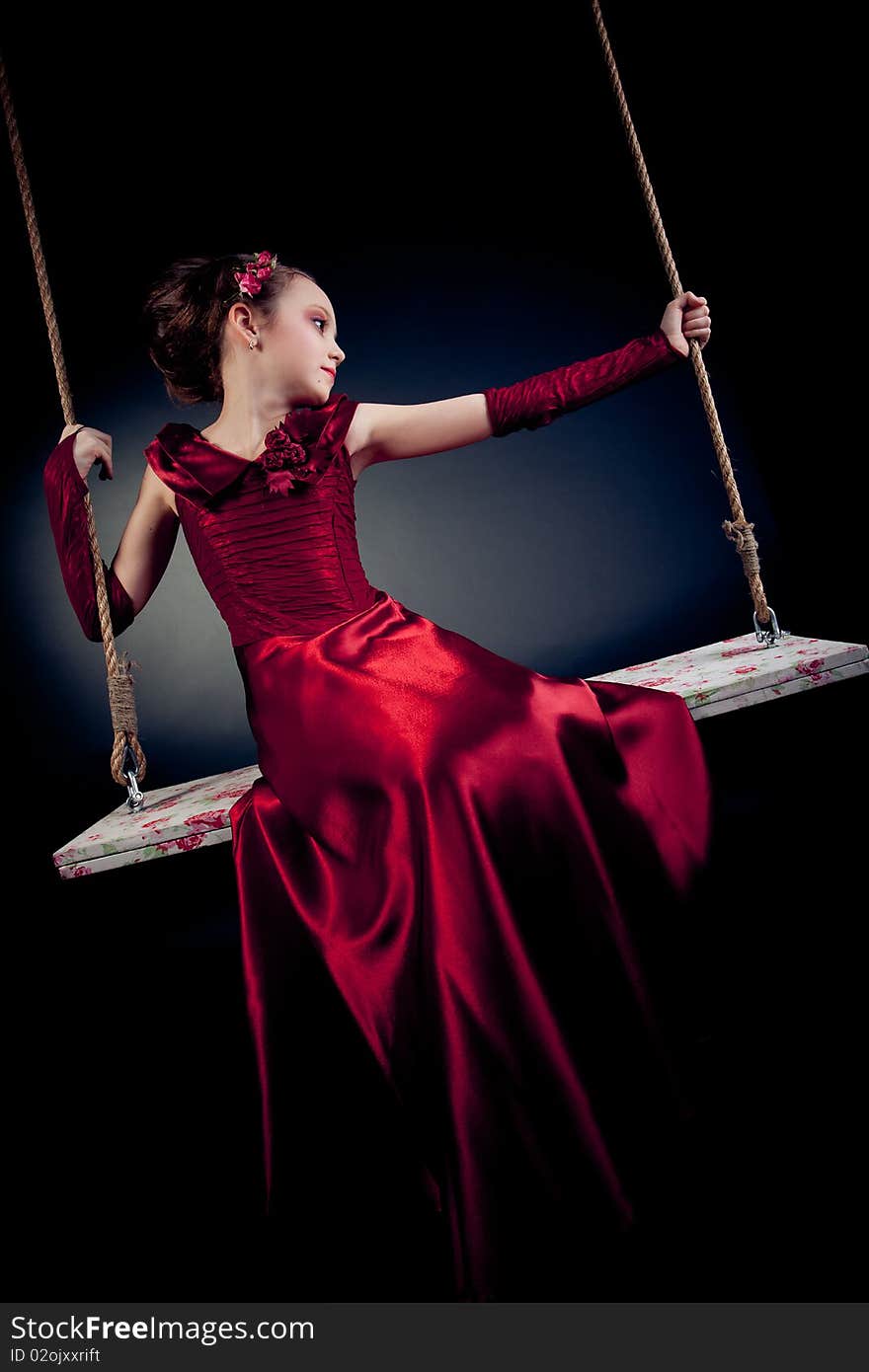 Young Girl Posing On Black Background