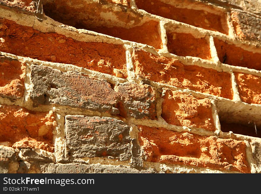 Brick wall of an ancient building in close up - background. Brick wall of an ancient building in close up - background